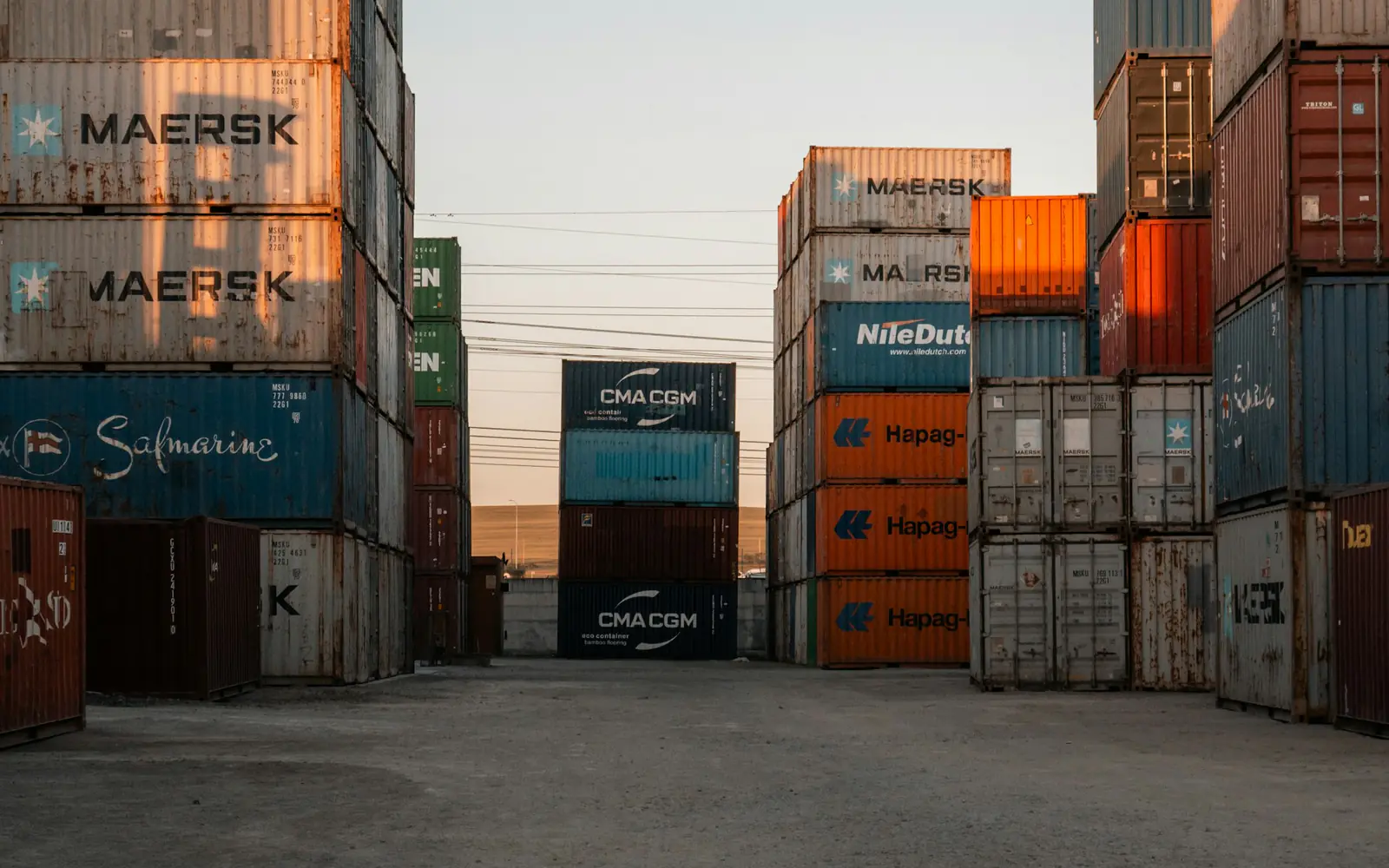 Stacks of shipping containers in a port yard